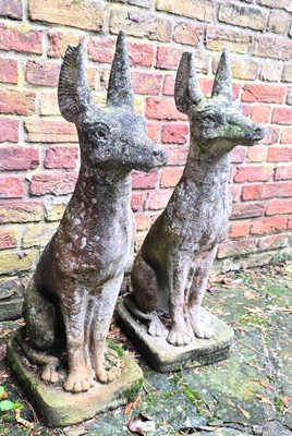 Lot 403 - A pair of stone garden Anubis sculptures;...