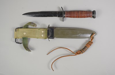 Lot 338 - A vintage US.M3 fight knife with an M8 scabbard.