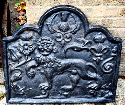 Lot 411 - An antique style cast iron fire back,...
