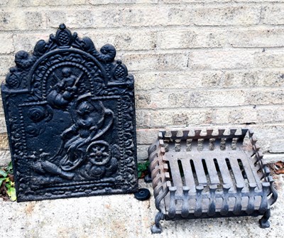 Lot 409 - An antique cast iron fireback, depicting woman...