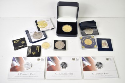 Lot 195 - A group of coins to include three Royal Mint...