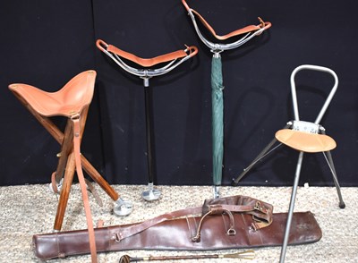 Lot 395 - A group of shooting stick seats to include an...