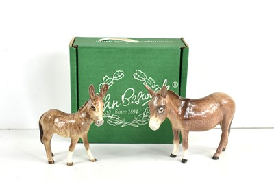 Lot 265 - Two Beswick porcelain donkeys, the largest...