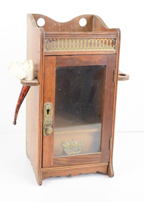 Lot 113 - An oak smokers cabinet with hanging racks and...