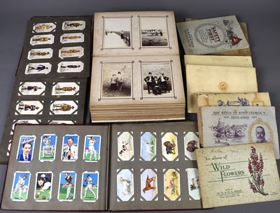 Lot 62 - An early 20th century photograph album...