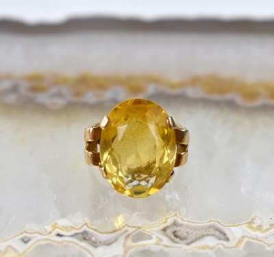 Lot 14 - A 9ct gold and citrine ring, size Q, 7.9g.