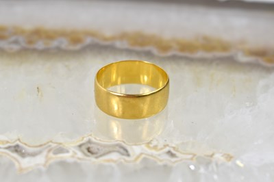 Lot 31 - A 22ct gold wedding band, size Q, 4.8g.