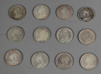 Lot 233 - A group of twelve Queen Victoria silver crowns,...
