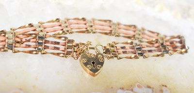 Lot 18 - A 9ct rose and yellow gold gate link bracelet...