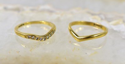 Lot 20 - Two 15ct gold wishbone rings, one set with...