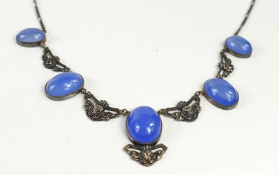 Lot 43 - An Art Deco silver and blue cabochon stone...