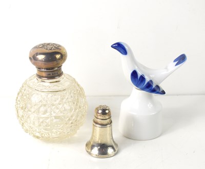 Lot 119 - A silver lidded cut glass bottle together with...