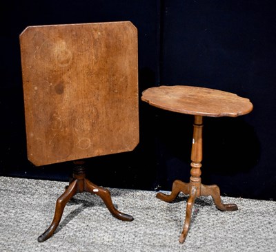 Lot 397 - A 19th century oak tilt top occasional table...