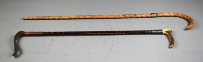 Lot 154 - An antique bamboo riding crop with bone handle...
