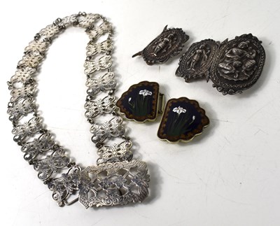 Lot 162 - A Burmese white metal belt buckle together...