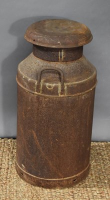 Lot 143 - A vintage metal milk churn, 68cm high.