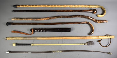 Lot 205 - A group of vintage walking canes / sticks,...