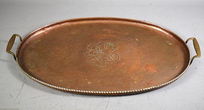 Lot 311 - Hugh Wallis; An arts and Crafts copper oval...