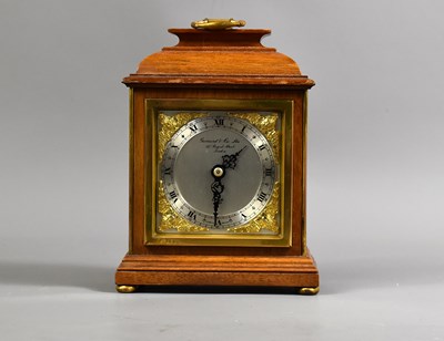 Lot 315 - An Elliot oak cased mantle clock, retailed by...