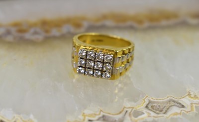 Lot 4 - An 18ct yellow and white gold twelve stone...