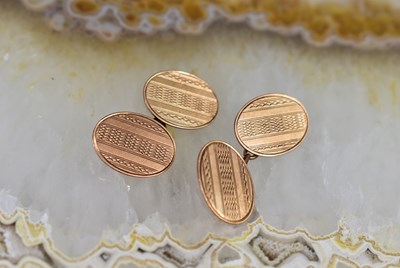 Lot 11 - A pair of 9ct rose gold cufflinks, with...