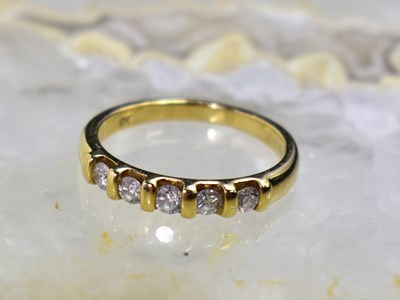 Lot 45A - A 9ct gold and five stone brilliant cut...
