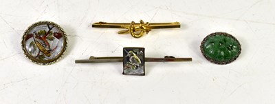 Lot 22 - A group of four brooches to include a white...