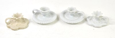 Lot 72 - A group of four ceramic chambersticks in the...