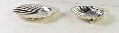 Lot 156 - Two silver scallop form dishes, the smaller...