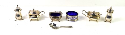 Lot 143 - A silver three piece cruet set, the salt and...