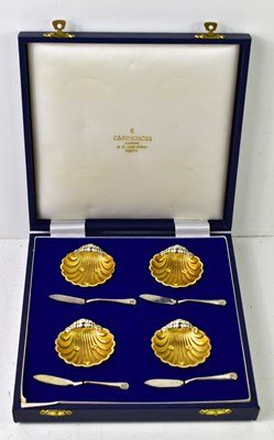 Lot 127 - A set of four silver plate and gilt salt...