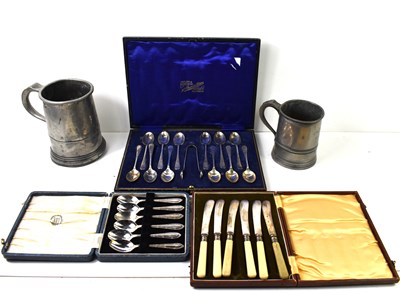 Lot 128 - A silver plated teaspoon and sugar nip set in...