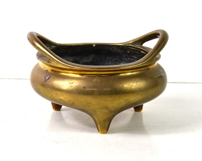 Lot 18 - A Chinese bronze tripod censer, of circular...