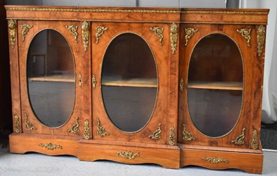 Lot 399 - A French walnut break front cabinet, with...