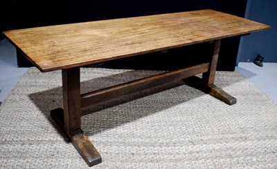 Lot 394 - An 18th century oak trestle table, with single...