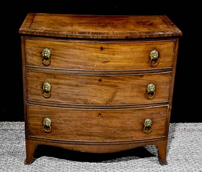 Lot 376 - A Georgian mahogany bow front chest of drawers,...