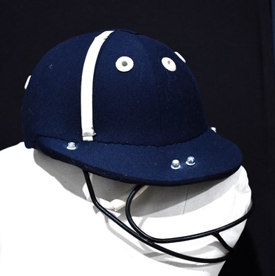 Lot 119 - A Harrods polo helmet in blue, bearing Harrods...
