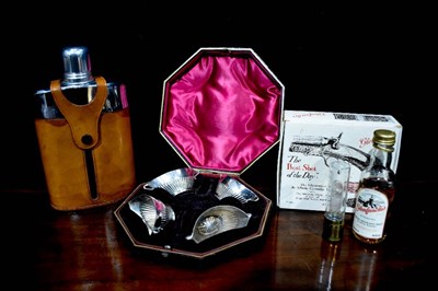 Lot 113 - A glass and steel vintage hip flask in leather...