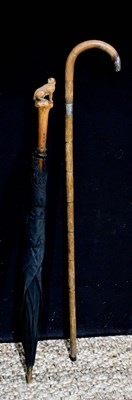 Lot 118 - An early 20th century umbrella, the handle...