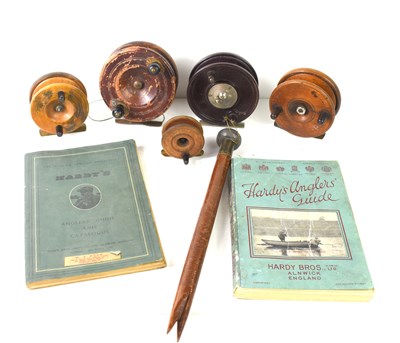 Lot 107 - A group of wooden centrepin reels together...
