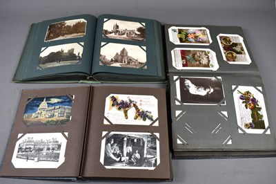 Lot 172 - Three albums of Edwardian and later postcards,...
