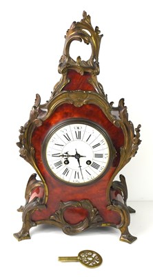 Lot 90 - A 19th century French mantel clock, the red...