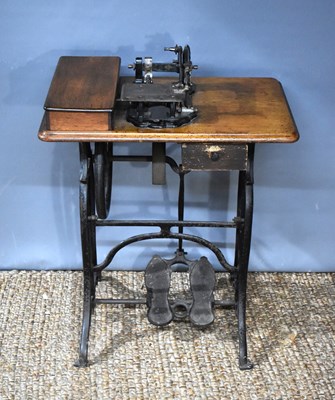 Lot 337 - A Victorian treadle sewing machine, used for...