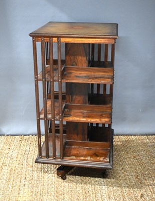 Lot 387 - An Edwardian mahogany and rosewood revolving...