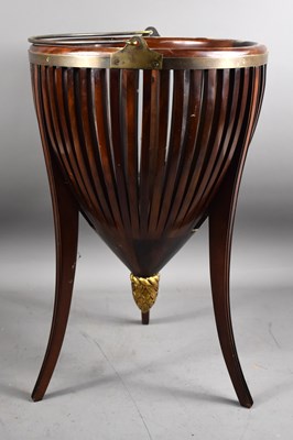 Lot 372 - An Edwardian mahogany basket jardiniere raised...