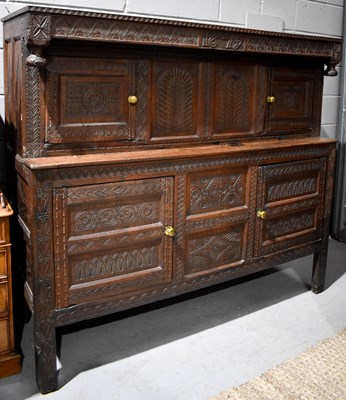 Lot 397 - A 17th century style oak court cupboard, the...