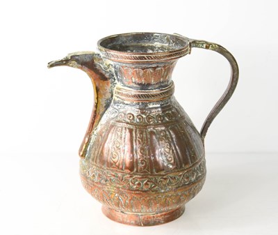 Lot 324 - A Middle Eastern 19th century copper jug /...