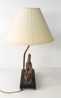 Lot 323 - An antique table lamp, the base carved in the...