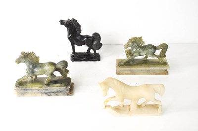 Lot 62 - A group of four carved horse statuettes; a...