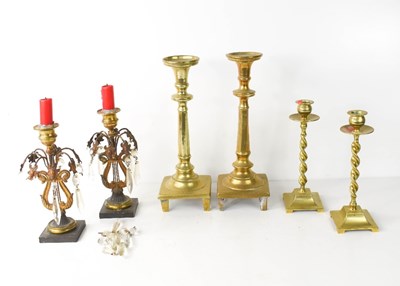 Lot 327 - A group of antique candlesticks, to include a...
